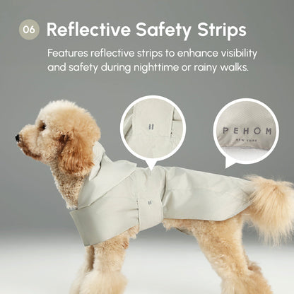 Dog wearing a light-colored raincoat with reflective safety strips, featuring the brand 'PEHOM'.