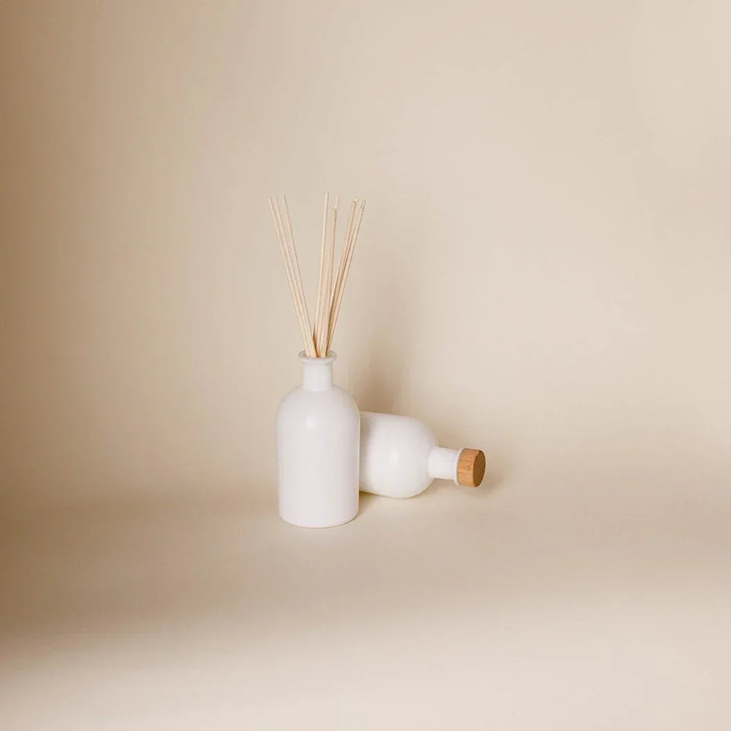 Denali reed diffuser with teak leather cedarwood and palo santo scent notes